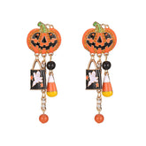 Festive Halloween earrings with candy corn and pumpkin designs, accented by cubic zirconia ghost dangles.